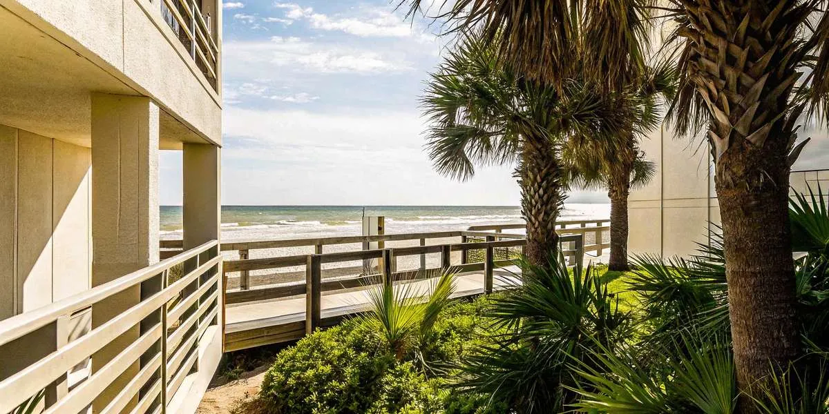Luxury beachfront condos along the emerald-green Gulf waters of Panama City Beach, Florida