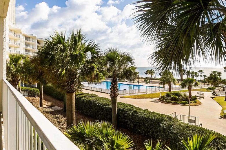 Laketown Wharf Panama City Beach resort swimming pool and lagoon views under a bright blue sky
